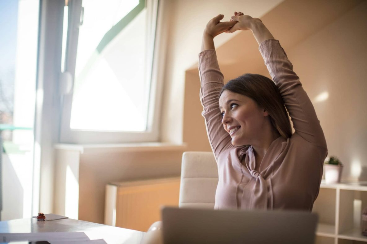 ‘Movement Snacks’ Are an Easy Way to Level Up Your Health Woman working at home is stretching
